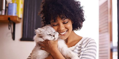 Woman Holding Her Fluffy White Cat