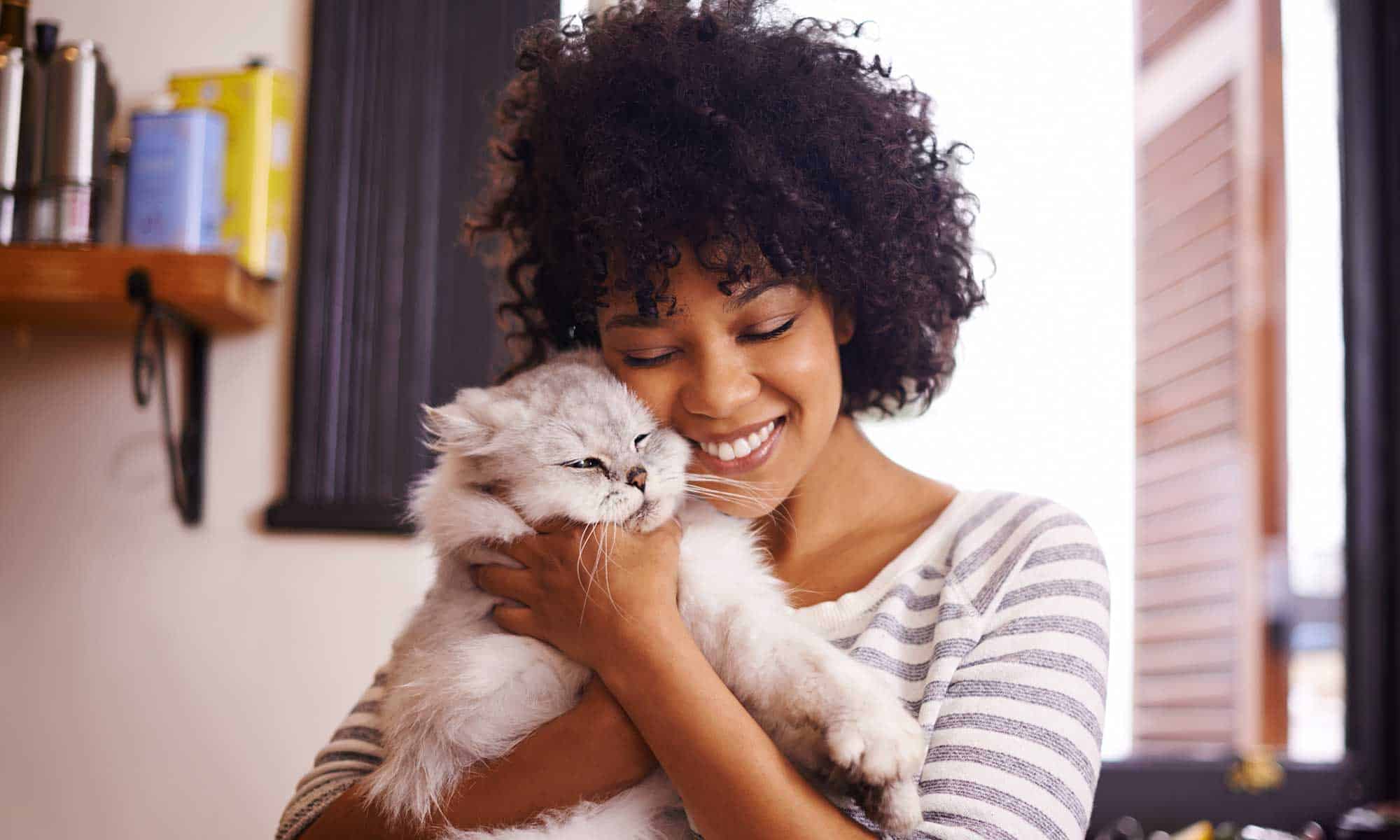 A woman holding her cat
